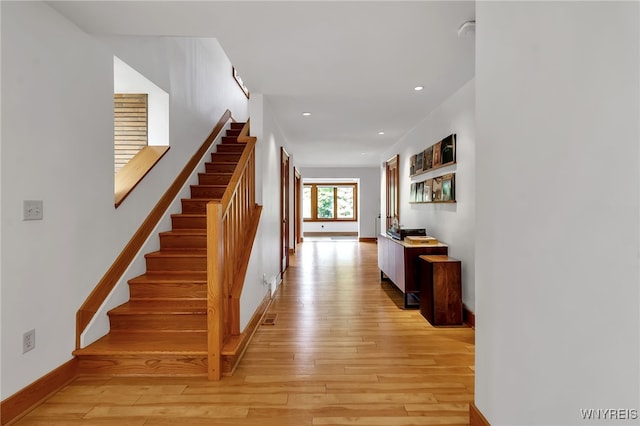 7 Lebrun Cir, Amherst, NY 14226 - corridor with light wood-type flooring, stairway, and recessed lighting