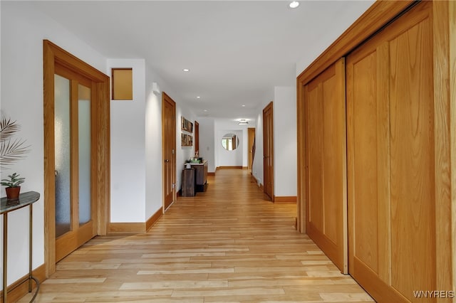 7 Lebrun Cir, Amherst, NY 14226 - hallway with light wood-style floors, recessed lighting, and french doors