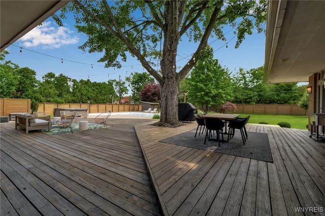 7 Lebrun Cir, Amherst, NY 14226 - wooden terrace with an outdoor hangout area, outdoor dining area, and a fenced backyard
