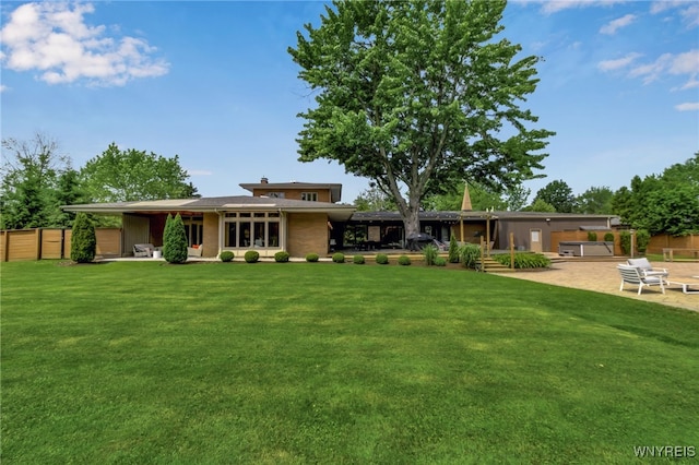 7 Lebrun Cir, Amherst, NY 14226 - rear view of property with a patio and a hot tub
