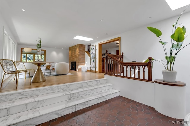 7 Lebrun Cir, Amherst, NY 14226 - living area featuring a skylight, stairway, a fireplace, and recessed lighting