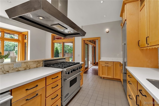 7 Lebrun Cir, Amherst, NY 14226 - kitchen featuring premium stove, exhaust hood, healthy amount of natural light, light tile patterned floors, and recessed lighting