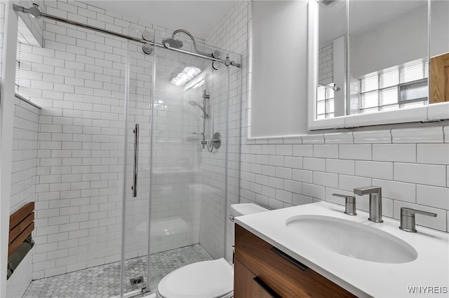 7 Lebrun Cir, Amherst, NY 14226 - full bathroom featuring vanity, a shower stall, and tile walls