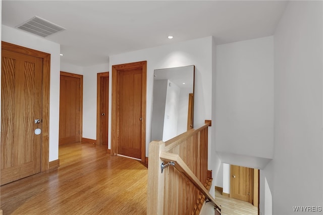 7 Lebrun Cir, Amherst, NY 14226 - hallway featuring an upstairs landing, light wood-type flooring, and recessed lighting
