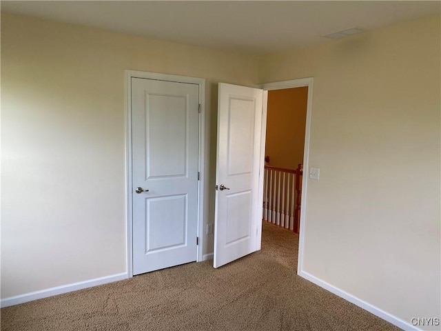 107 Shaker Hts, Camillus, NY 13031 - unfurnished bedroom with carpet floors and baseboards