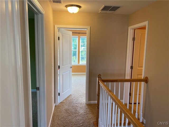 107 Shaker Hts, Camillus, NY 13031 - corridor featuring carpet floors and an upstairs landing