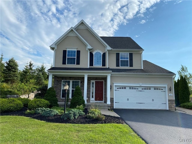 107 Shaker Hts, Camillus, NY 13031 - view of front of house featuring driveway, a front lawn, a porch, and stone siding
