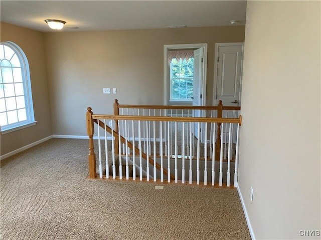 107 Shaker Hts, Camillus, NY 13031 - corridor with carpet flooring and an upstairs landing