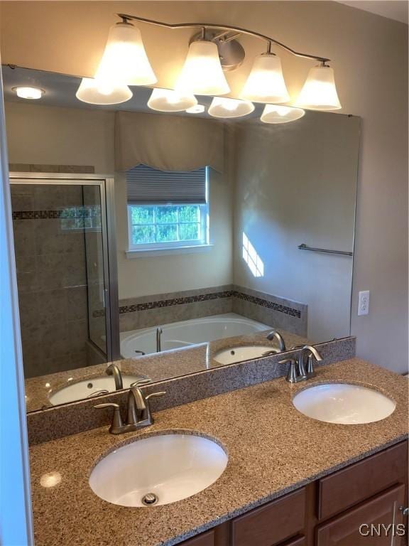 107 Shaker Hts, Camillus, NY 13031 - bathroom featuring a whirlpool tub, a shower stall, and double vanity
