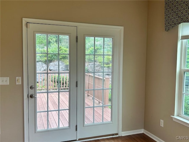 107 Shaker Hts, Camillus, NY 13031 - doorway to outside featuring baseboards and wood finished floors