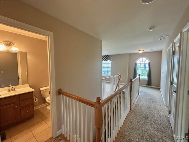 107 Shaker Hts, Camillus, NY 13031 - corridor with an upstairs landing and light tile patterned flooring