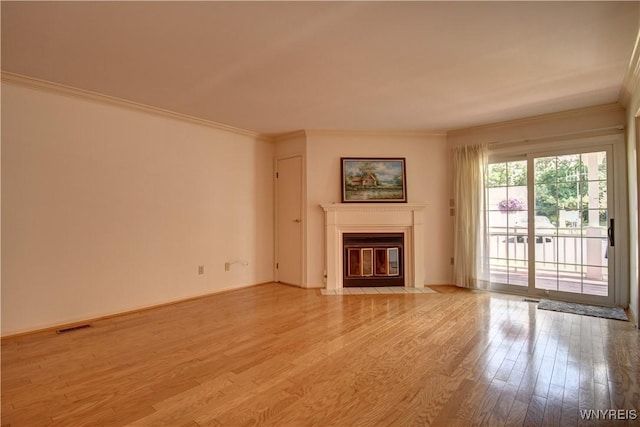 1175 Youngs Rd Unit C, Amherst, NY 14221 - unfurnished living room featuring light wood finished floors, ornamental molding, and a fireplace with flush hearth
