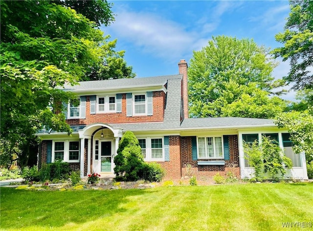 2721 Bowen Rd, Elma, NY 14059 - view of front facade with a chimney, brick siding, and a front yard