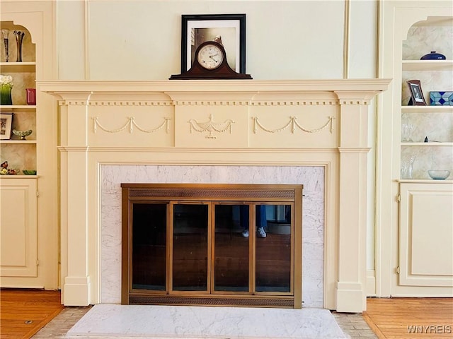 2721 Bowen Rd, Elma, NY 14059 - detailed view of a fireplace, built in features, and wood finished floors
