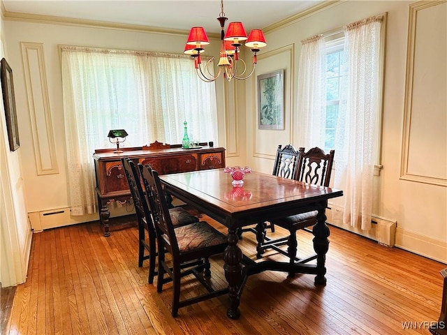 2721 Bowen Rd, Elma, NY 14059 - dining area with a chandelier, crown molding, wood-type flooring, and a baseboard radiator