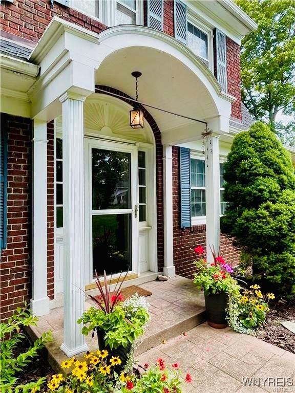 2721 Bowen Rd, Elma, NY 14059 - doorway to property with brick siding and a porch