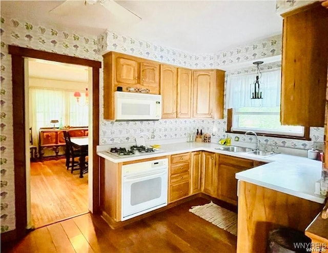 2721 Bowen Rd, Elma, NY 14059 - kitchen with white appliances, wallpapered walls, dark wood-style flooring, light countertops, and a ceiling fan