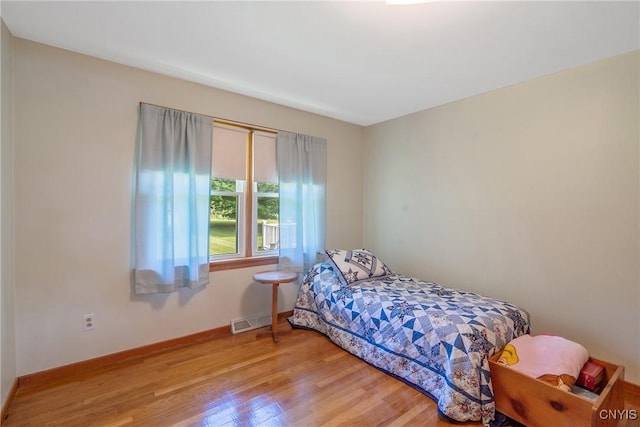 206 Oswego River Rd, Schroeppel, NY 13135 - bedroom with light wood-style flooring and baseboards