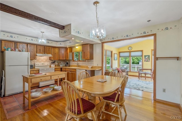 206 Oswego River Rd, Schroeppel, NY 13135 - dining space with a chandelier and light wood finished floors