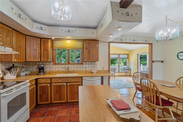 206 Oswego River Rd, Schroeppel, NY 13135 - kitchen with a chandelier, white appliances, light countertops, and backsplash