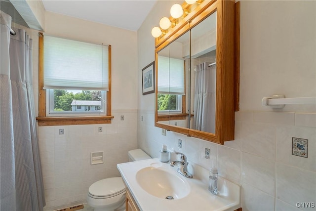 206 Oswego River Rd, Schroeppel, NY 13135 - full bathroom featuring tile walls, plenty of natural light, vanity, and curtained shower