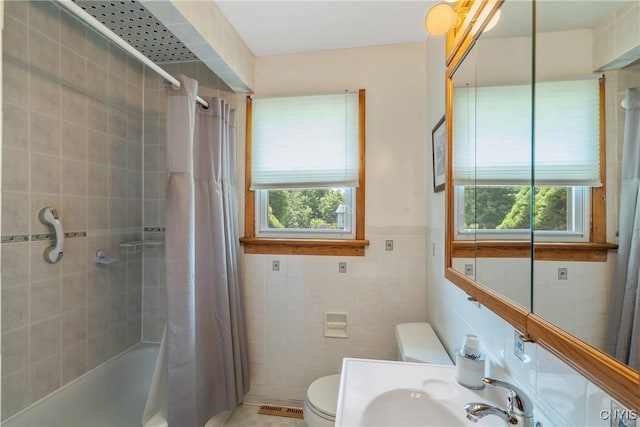 206 Oswego River Rd, Schroeppel, NY 13135 - bathroom featuring tile walls and shower / tub combo with curtain
