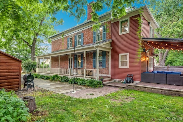 626 Main St, Porter, NY 14174 - view of front facade featuring an outdoor living space, covered porch, a chimney, and a front lawn