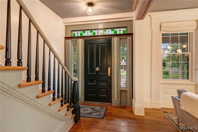 626 Main St, Porter, NY 14174 - entrance foyer with hardwood / wood-style floors, stairway, and crown molding