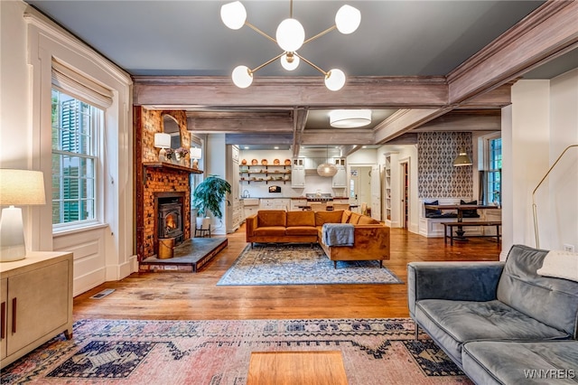 626 Main St, Porter, NY 14174 - living room featuring wood finished floors, ornamental molding, and coffered ceiling