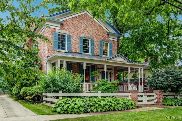 626 Main St, Porter, NY 14174 - view of front facade with a porch and brick siding