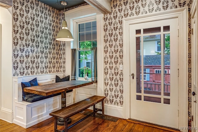 626 Main St, Porter, NY 14174 - dining space with wallpapered walls, breakfast area, hardwood / wood-style flooring, healthy amount of natural light, and wainscoting
