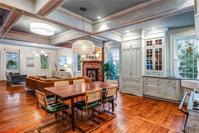 626 Main St, Porter, NY 14174 - dining room with a chandelier, light wood-type flooring, plenty of natural light, ornamental molding, and beamed ceiling