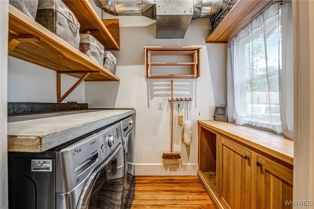 626 Main St, Porter, NY 14174 - washroom with washer and clothes dryer and light wood-type flooring