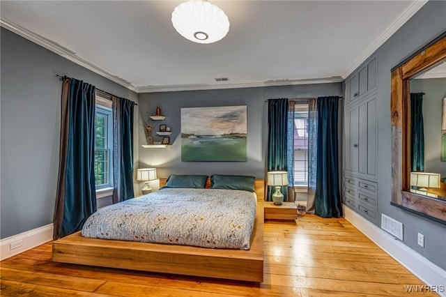 626 Main St, Porter, NY 14174 - bedroom with light wood finished floors and ornamental molding