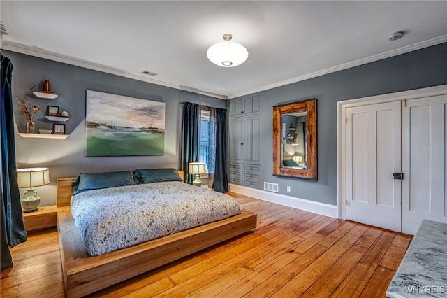 626 Main St, Porter, NY 14174 - bedroom featuring light wood-type flooring and ornamental molding