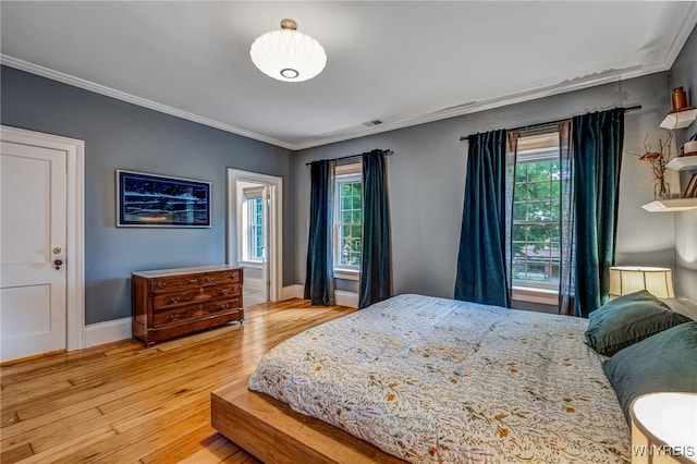 626 Main St, Porter, NY 14174 - bedroom with light wood-style flooring and ornamental molding