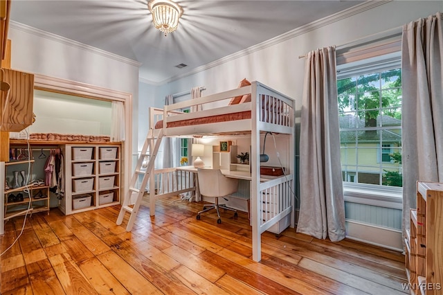 626 Main St, Porter, NY 14174 - bedroom with crown molding, wood-type flooring, a desk, and a chandelier