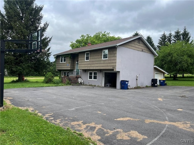 4067 Taylor Rd, Pompey, NY 13078 - back of house with a chimney and asphalt driveway