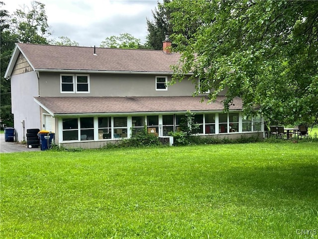 4067 Taylor Rd, Pompey, NY 13078 - rear view of house featuring stucco siding, a yard, a chimney, and a sunroom