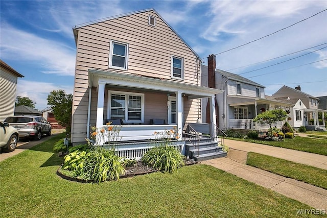 2910 Weston Ave, Niagara Falls, NY 14305 - american foursquare style home featuring covered porch and a front yard