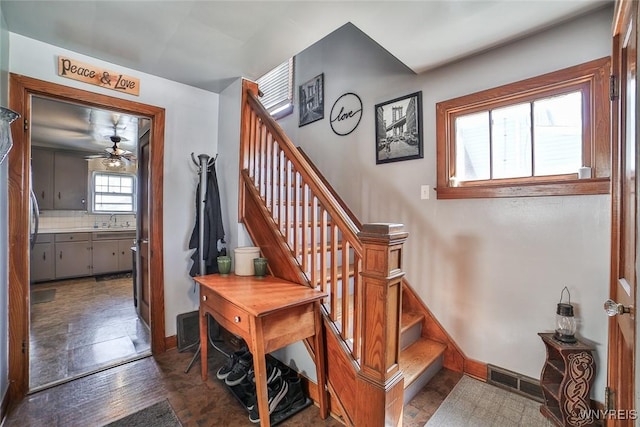 2910 Weston Ave, Niagara Falls, NY 14305 - stairs featuring baseboards and a ceiling fan