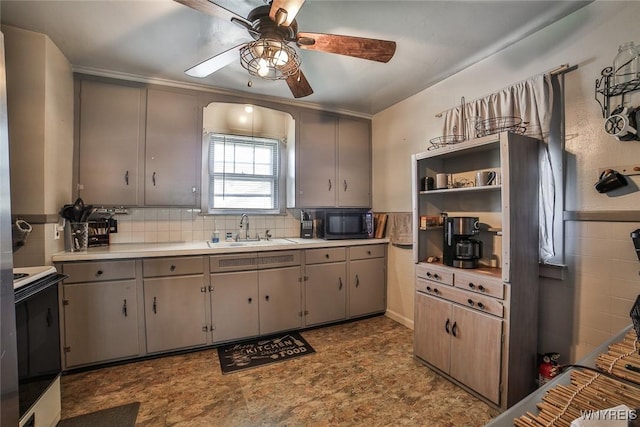 2910 Weston Ave, Niagara Falls, NY 14305 - kitchen with white range with electric cooktop, ceiling fan, black microwave, and gray cabinets