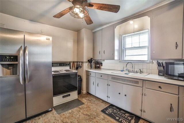 2910 Weston Ave, Niagara Falls, NY 14305 - kitchen featuring stainless steel fridge, white range with electric stovetop, a ceiling fan, tasteful backsplash, and light countertops
