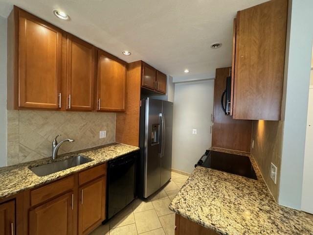 1000 E Ave Unit Un208, Rochester, NY 14607 - kitchen with stainless steel fridge with ice dispenser, dishwasher, stove, decorative backsplash, and light stone counters