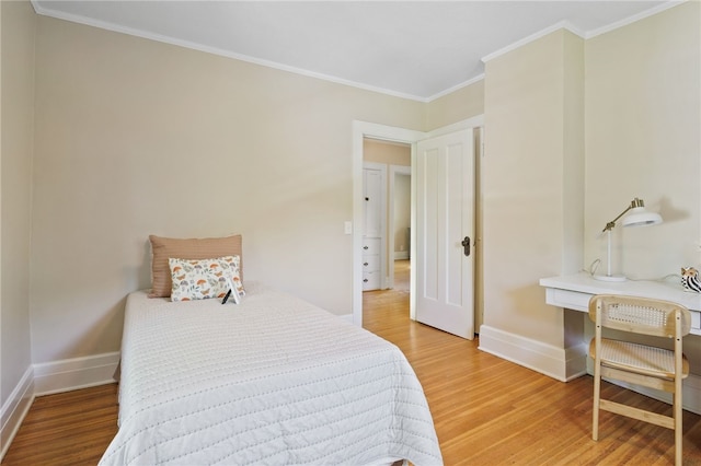 234 Pine Grove Ave, Irondequoit, NY 14617 - bedroom with light wood finished floors, crown molding, and a desk