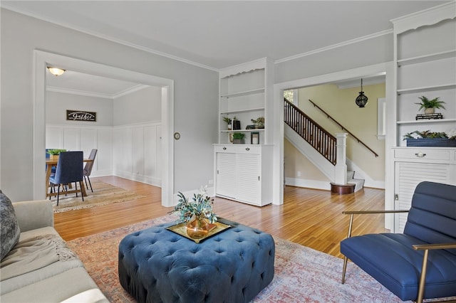234 Pine Grove Ave, Irondequoit, NY 14617 - living room with wood finished floors, stairway, and ornamental molding