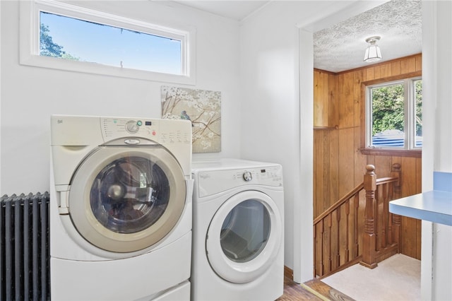 234 Pine Grove Ave, Irondequoit, NY 14617 - washroom with radiator, washing machine and dryer, and light wood-style floors