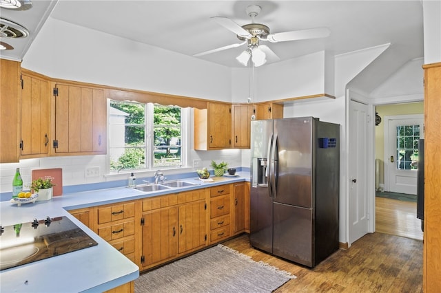 234 Pine Grove Ave, Irondequoit, NY 14617 - kitchen with stainless steel refrigerator with ice dispenser, light countertops, wood finished floors, a ceiling fan, and black electric stovetop