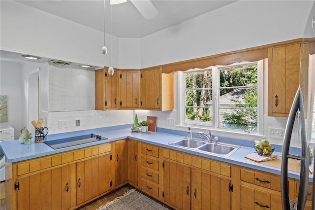 234 Pine Grove Ave, Irondequoit, NY 14617 - kitchen featuring black electric cooktop, refrigerator, light countertops, and backsplash