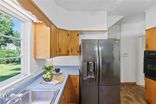 234 Pine Grove Ave, Irondequoit, NY 14617 - kitchen featuring stainless steel fridge with ice dispenser, black oven, decorative backsplash, dark wood-style flooring, and brown cabinets